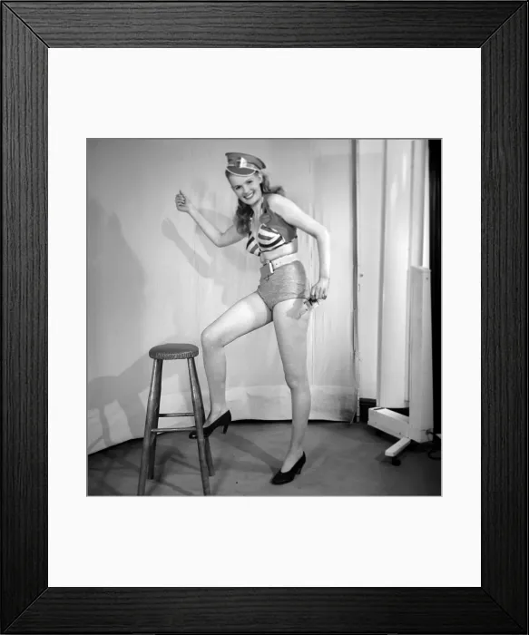 Framed Print : Woman wearing fancy dress bus condutors uniform. 1959