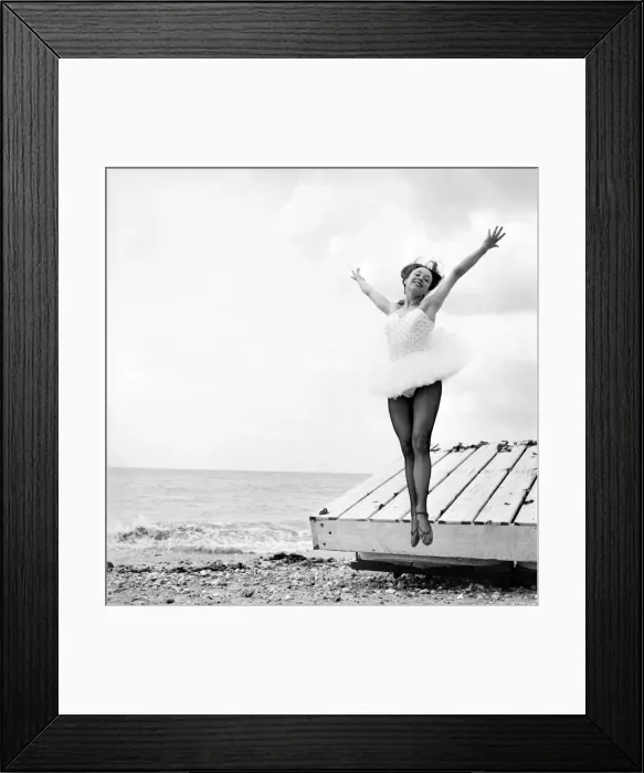 Framed Print : Ballerina Anne Youngmen seen here in a tutu practising her dance moves beside the sea Framed Print : Ballerina Anne Youngmen seen here in a tutu practising her dance moves beside the sea