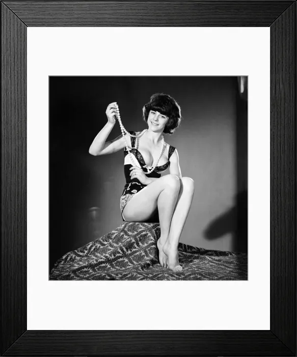 Framed Print : Barbara Broomfield modelling string of beads. 1965