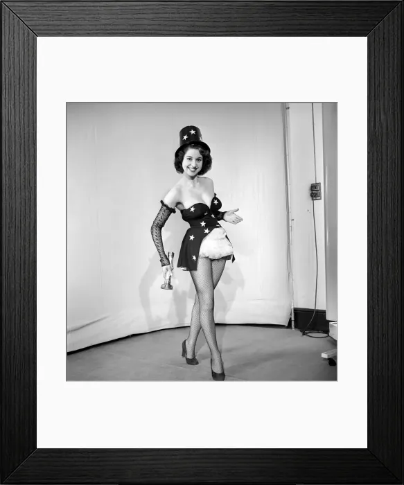 Framed Print : Woman cinema usher wearing star pattern top hat and dress holding a torch. 1959 E41 Framed Print : Woman cinema usher wearing star pattern top hat and dress holding a torch. 1959 E41