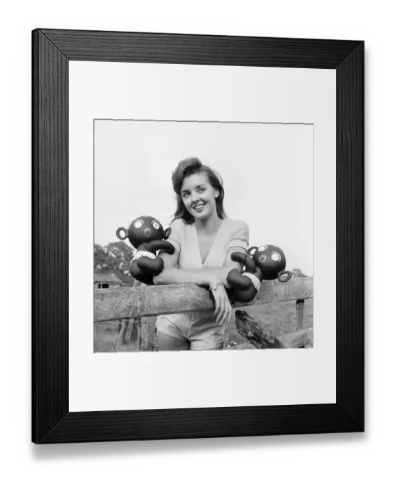 Framed Print : Model Kim Pearson seen here with inflatable alien toys. 1962 E422-002