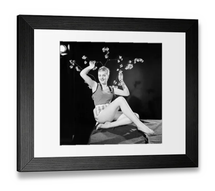 Framed Print : Ruth Calvert seen here modelling the latest 1959 springtime fashions posing with blossom Framed Print : Ruth Calvert seen here modelling the latest 1959 springtime fashions posing with blossom