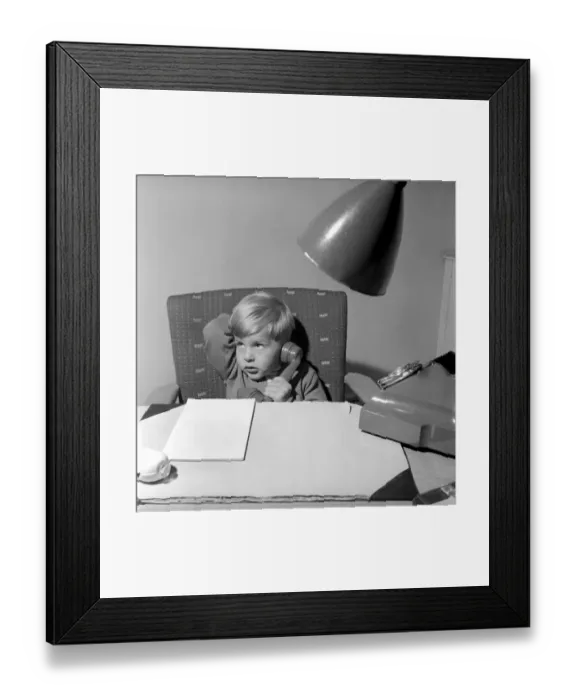 Framed Print : Office Junior: Two year old boy helps out at the offices of Theobald and son. 1957 Framed Print : Office Junior: Two year old boy helps out at the offices of Theobald and son. 1957