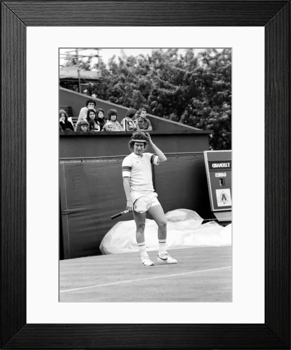 Framed Print : American tennis star John McEnroe in action at Queens Club. June 1980 Framed Print : American tennis star John McEnroe in action at Queens Club. June 1980