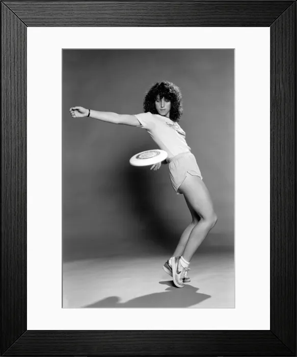 Framed Print : A woman performing exercises with a frisbee. June 1980