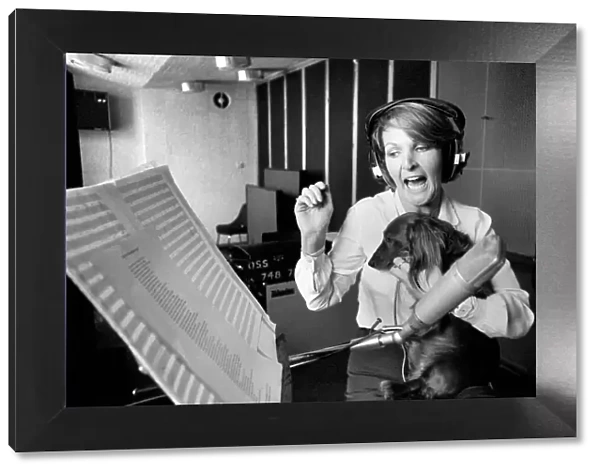 Actress Penelope Keith makes a record about a Dachsund dog. June 1980 80-03067-004