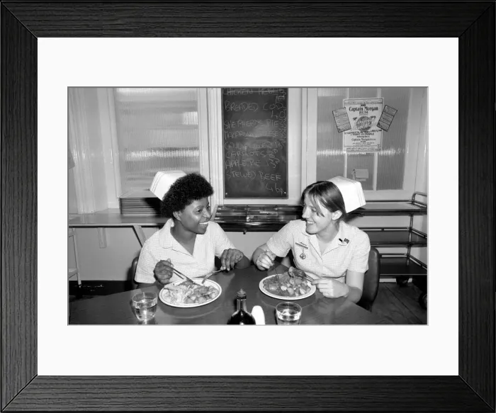 Framed Print : Nurses Nicola Reive (21) and Dawn Hamer (22) eating lunch in the Canteen at The Prince of Framed Print : Nurses Nicola Reive (21) and Dawn Hamer (22) eating lunch in the Canteen at The Prince of