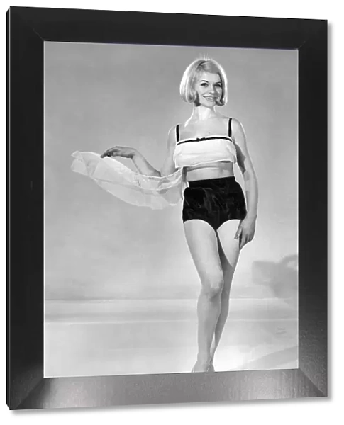 Model Vyvyan Dunbar wearing swimwear top and shorts. July 1965 P007738