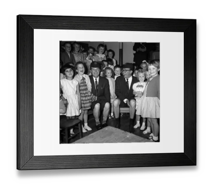 Framed Print : Morecambe & Wise with children of the Hamlet of Ratcliff school Stepney London wearing