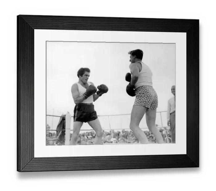 Framed Print : Film star Stewart Granger spars with Freddie Mills at the Ford Families Gala