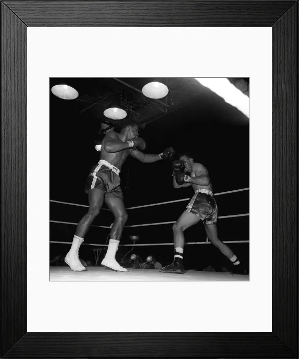 Framed Print : Action during the non-title heavyweight fight between American Cassius Clay