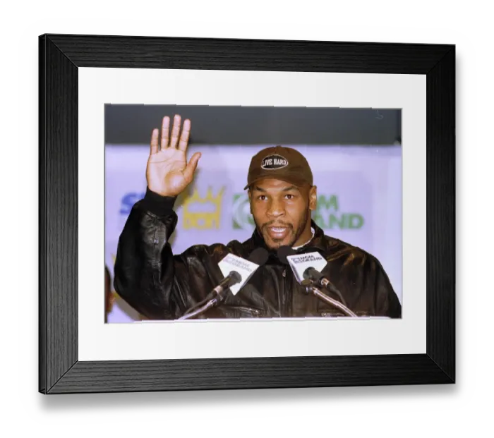 Framed Print : Mike Tyson waves during the head to head press Conference for the Heavyweight World Title
