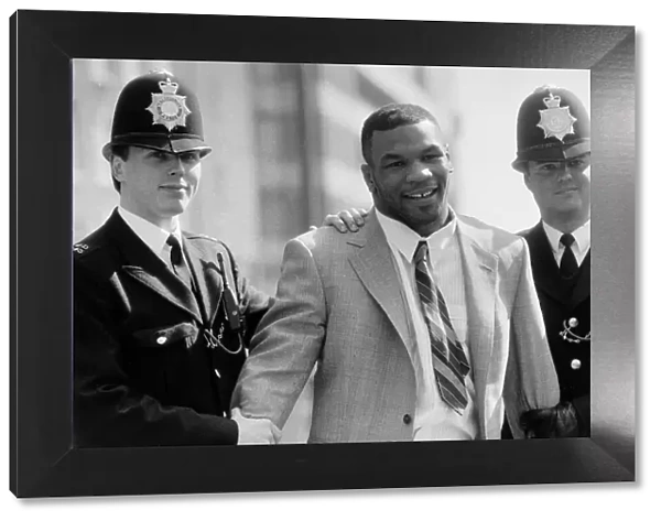 Mike Tyson being held by police March 1987