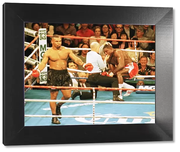 Frank Bruno is stopped by the referee in the 3rd round against Mike Tyson in his