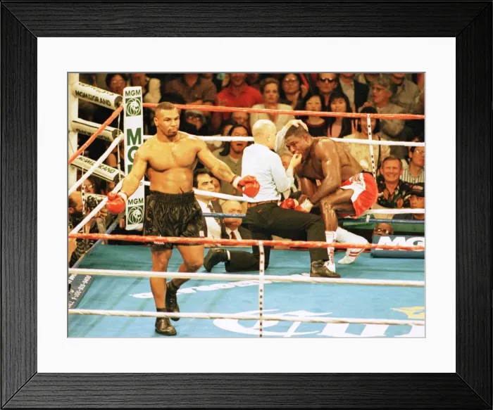 Framed Print : Frank Bruno is stopped by the referee in the 3rd round against Mike Tyson in his Framed Print : Frank Bruno is stopped by the referee in the 3rd round against Mike Tyson in his