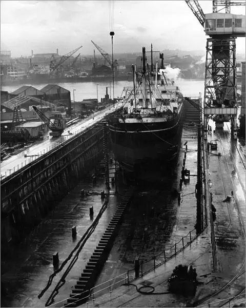 The giant size of the dry dock at Brigham and Cowans, South Shields is seen here with
