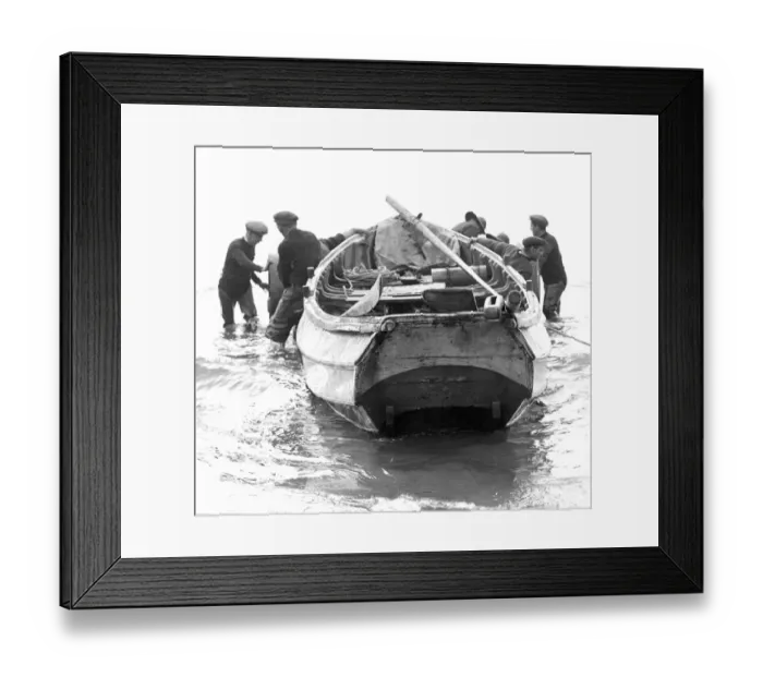 Framed Print : Newbiggin fishermen prepare to beach their craft, after the morning Framed Print : Newbiggin fishermen prepare to beach their craft, after the morning