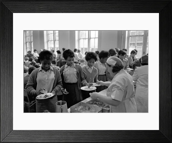 Framed Print : School Dinners. General scenes of school dinner. Ladies serving meal to pupils in Framed Print : School Dinners. General scenes of school dinner. Ladies serving meal to pupils in