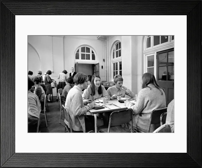 Framed Print : School Dinners. General scenes of school dinner. Ladies serving meal to pupils in Framed Print : School Dinners. General scenes of school dinner. Ladies serving meal to pupils in