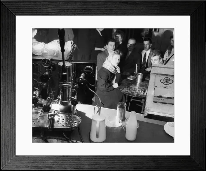 Framed Print : Customers enjoy a game of chess as they relax in one of London Framed Print : Customers enjoy a game of chess as they relax in one of London
