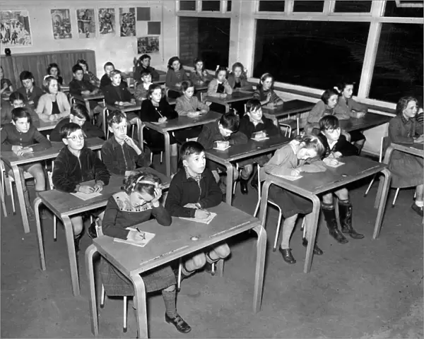 A class at Poundwick junior School in Woodhouse Park sit for their Grammar School