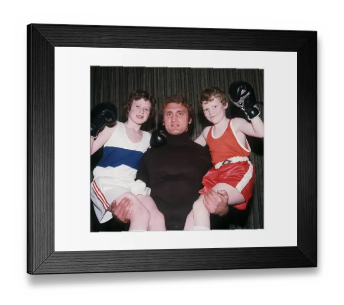 Framed Print : Joe Bugner boxer lifting up children December 1975 Framed Print : Joe Bugner boxer lifting up children December 1975