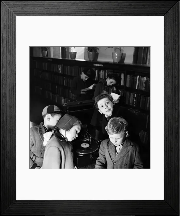 Framed Print : Children listerning to talking books at Bermondsey Library. January 1953 C6332 Framed Print : Children listerning to talking books at Bermondsey Library. January 1953 C6332