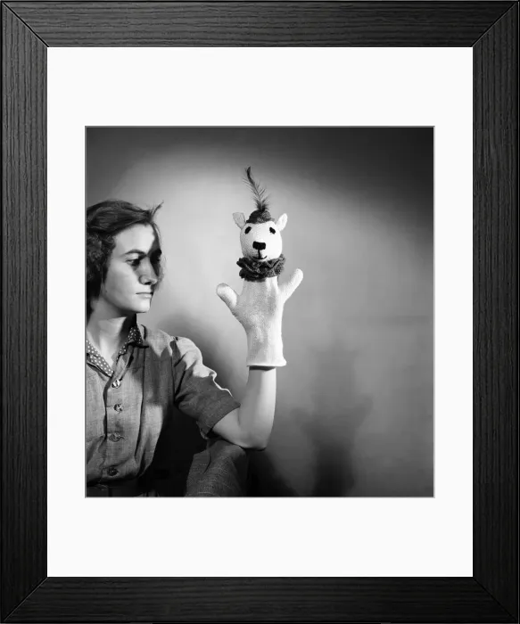 Framed Print : K. 41-Knitting woman modelling knitted hand puppet. February 1952 C6278