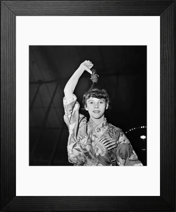 Framed Print : Anzti Loops her hair to go on hook in circus act. November 1952 C5390-001 Framed Print : Anzti Loops her hair to go on hook in circus act. November 1952 C5390-001