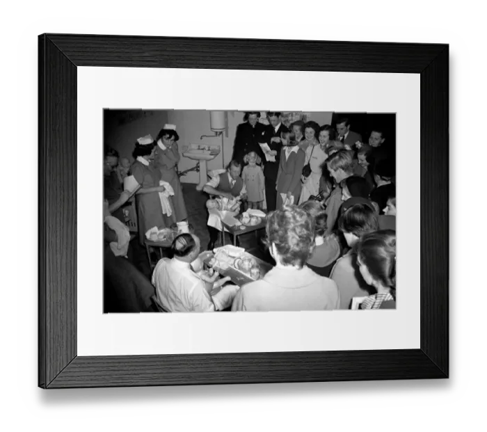 Framed Print : Baby-craft competition. Ian Stewart demonstrating how to bath a baby