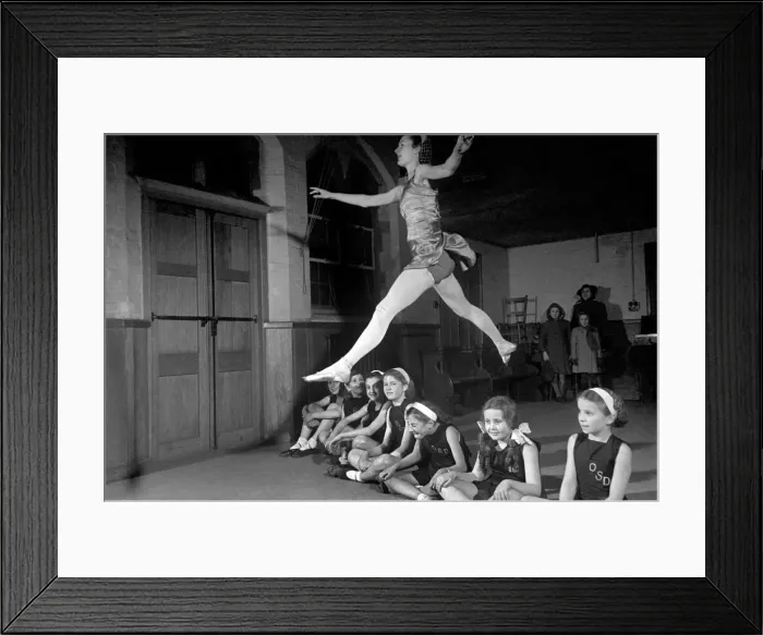 Framed Print : Ballet dancer Maureen Gardner gives instructions to children during one of her classes