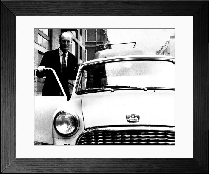 Framed Print : Lord Montagu of Beaulieu April 1963. Poses next to his Mini motor car Framed Print : Lord Montagu of Beaulieu April 1963. Poses next to his Mini motor car