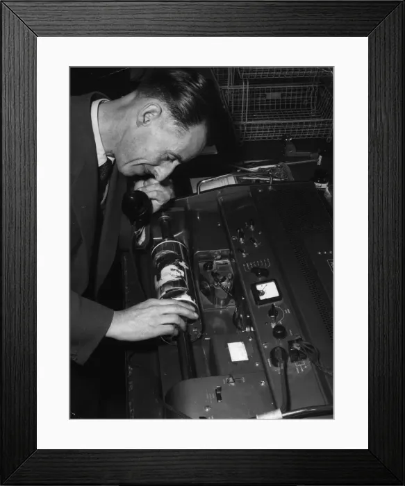 Framed Print : Technician overseeing the transmission of an image in the Telephoto room at the Daily Framed Print : Technician overseeing the transmission of an image in the Telephoto room at the Daily