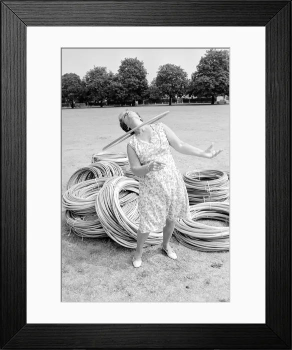 Framed Print : Pensioner playing with Hula Hoops in a Twickenham park. August 1976 P76 734 Framed Print : Pensioner playing with Hula Hoops in a Twickenham park. August 1976 P76 734