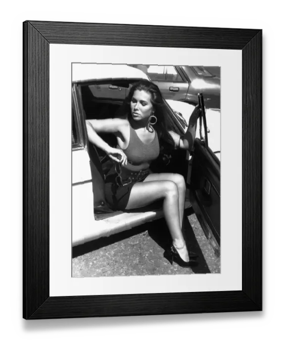 Framed Print : Model demostrates the right & wrong way to get out of a motor car