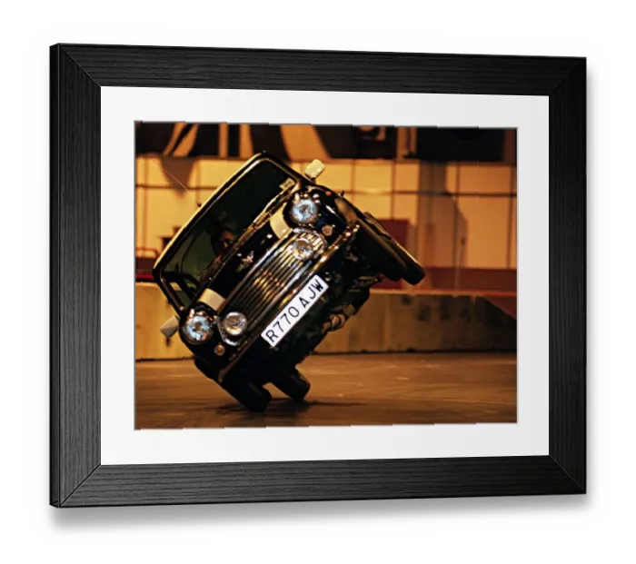 Framed Print : Stunt driver performs a stunt in a mini cooper motor car at the Exhibition Centre for Framed Print : Stunt driver performs a stunt in a mini cooper motor car at the Exhibition Centre for