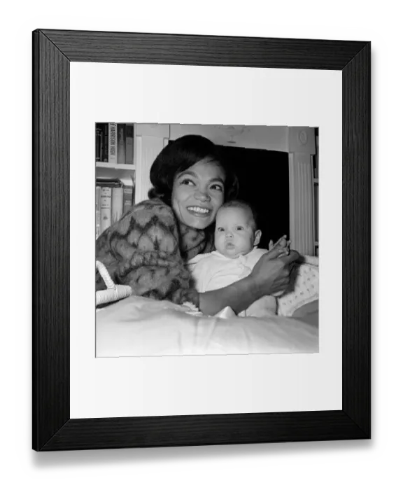Framed Print : American singer and actress Eartha Kitt, photographed with her baby girl Kitt