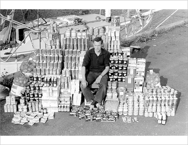 Robin Knox-Johnston with his provisions he will take on his yacht Suhaili