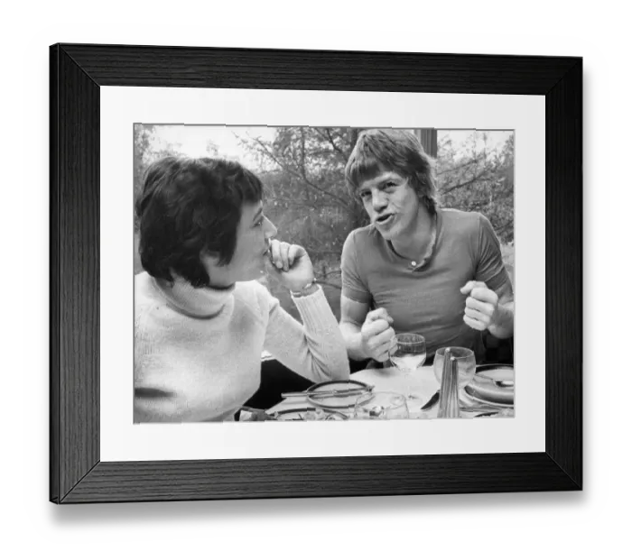 Framed Print : Actor Robin Askwith is interviewed over lunch by reporter Avril Deane while he was