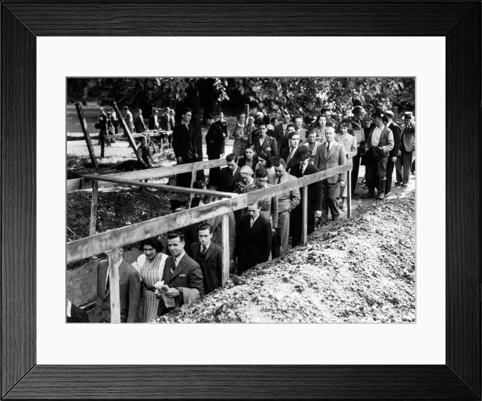 Framed Print : Crowds make their way down to an underground shelter as the air raid siren sounds minutes