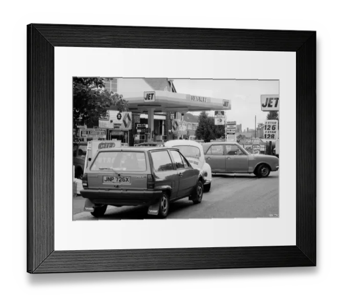 Framed Print : Petrol Wars. Cars queue at Jet Petrol station which has cut its price per gallon