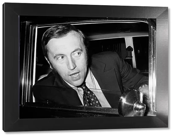 David Frost driving away from his London Home in his Bentley after splitting up with his