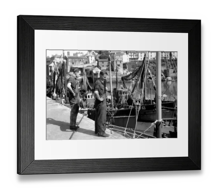 Framed Print : Fisherman on the quayside look longing at the boats of Fishing fleet at Brixham, Devon Framed Print : Fisherman on the quayside look longing at the boats of Fishing fleet at Brixham, Devon