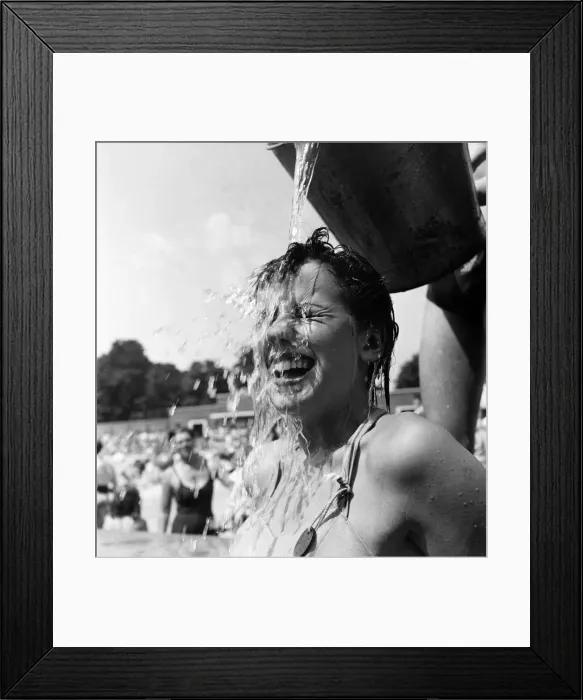 Framed Print : Young girl keeps cool during the hot weather. July 1952 C3326 Framed Print : Young girl keeps cool during the hot weather. July 1952 C3326