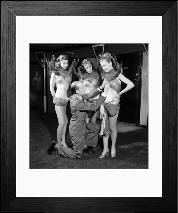 Framed Print : Casino showgirls model their latest costumes which include the invisible bra seen here