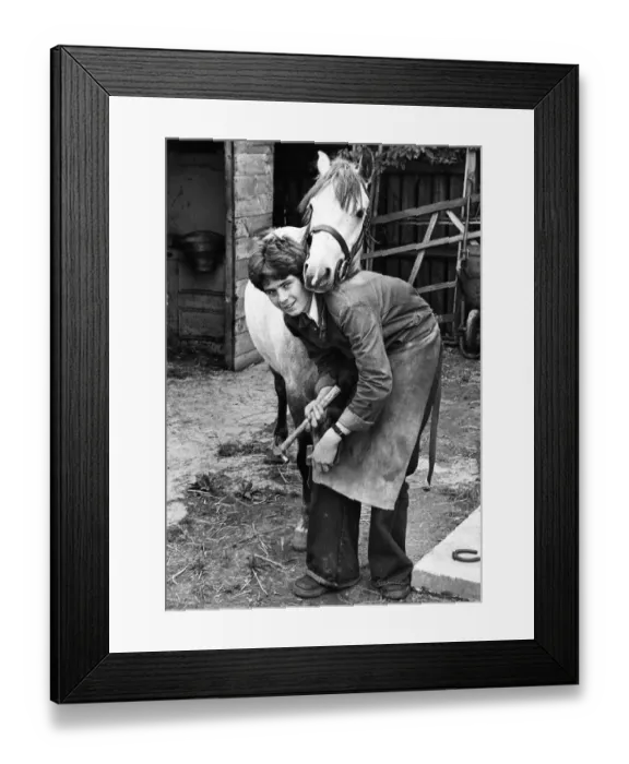 Framed Print : Schoolboy Trevor Escott is spending part of his school holidays helping to shoe horses