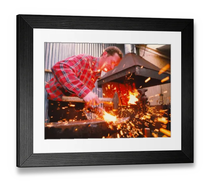Framed Print : Blacksmith Craig Knowles at work in his forge
