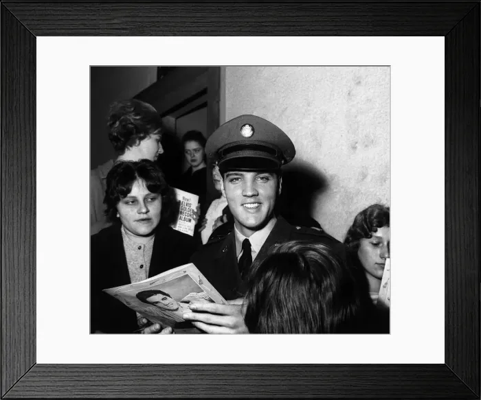 Framed Print : Elvis Presley signs autographs at press conference March 1960 for fans in Germany