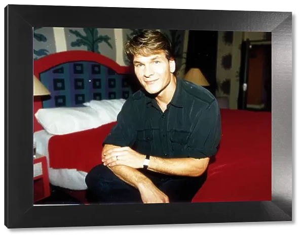 Patrick Swayze actor October 1992. Sitting on bed