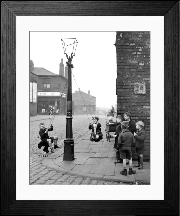 Framed Print : Children in a Manchester Street find their own enjoyment with the aid of a rope